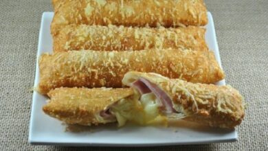 Cigarretes de presunto e queijo deliciosos petiscos e perfeitos